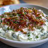 Rich and tangy caramelized onion dip made with Greek yogurt, perfect for parties or casual snacking.