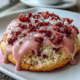 Delicate melt-in-your-mouth strawberry cookies topped with vibrant pink icing and freeze-dried strawberry crumbles.  