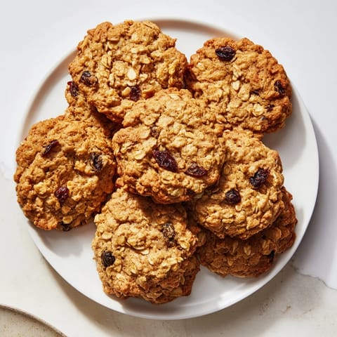 Oatmeal Raisin Cookies fresh from the oven with cinnamon spice and golden edges.