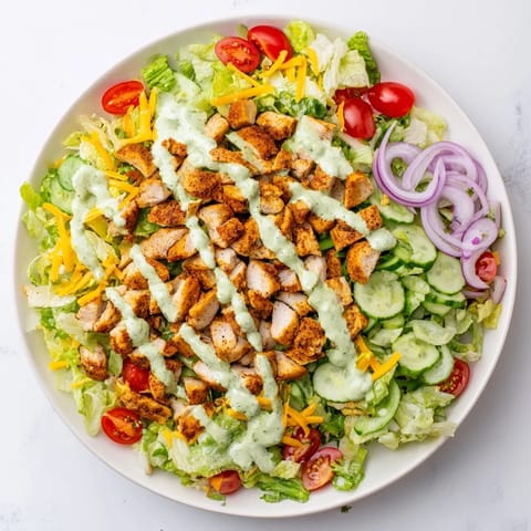 Vibrant Jalapeño Ranch Chicken Salad with spicy, creamy dressing and crunchy tortilla strips for a zesty American main dish.  