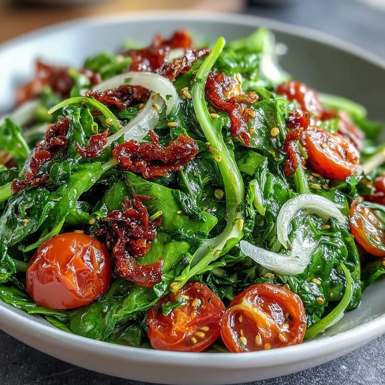 Zesty lemon dressing coats dandelion greens, cherry tomatoes, and Parmesan in this vibrant, Mediterranean-inspired vegetarian salad.  